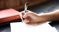 woman writing in journal