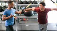 Personal trainer helps with resistance training