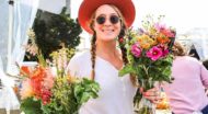 Woman in sunglasses holds two flower bouquets