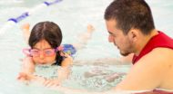 JCCSF swim instructor teaches young girl