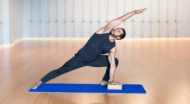 Man stretches in yoga pose