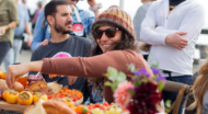 People eating around a table outdoors